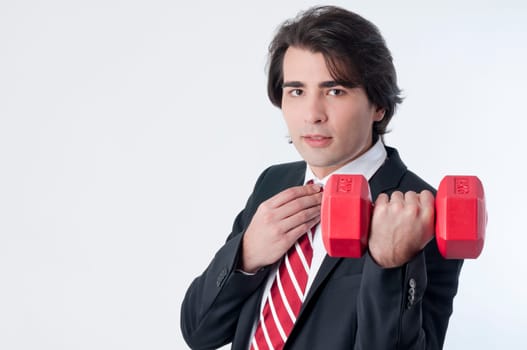 Businessman training with a weightlifting