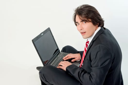 Young man browsing on a notebook