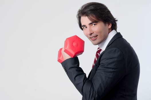 Businessman training with a weightlifting
