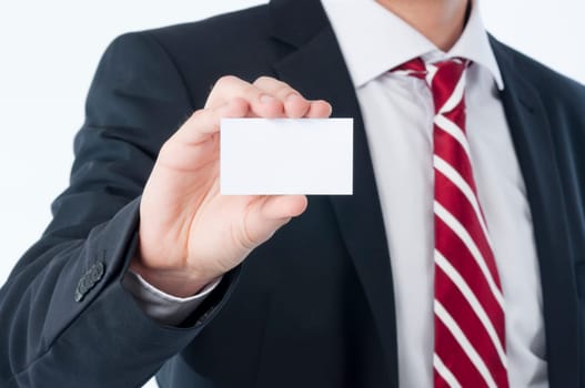 Young man holding an empty business card in his hand