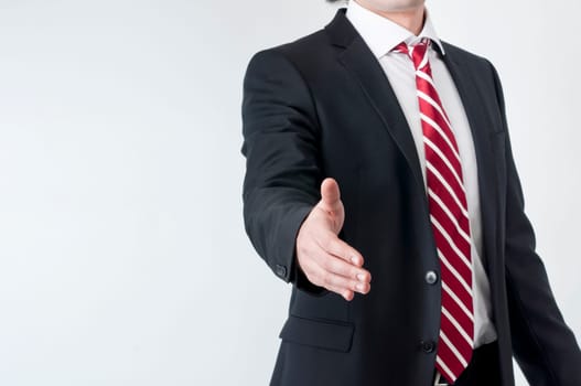 A business man with an open hand ready to seal a deal