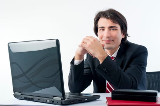 Man smiling from his desk isolated on a white background