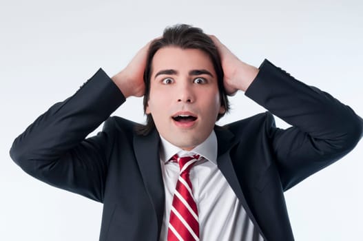 Worried businessman isolated on white background