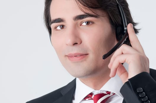 Isolated studio picture from a young callcenter agent