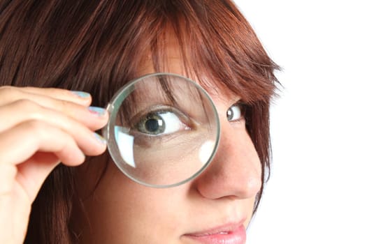 Girl looking for something with a magnifying glass