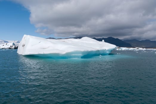 iceberg lake in Iceland Jokulsarlon with the blue and gray sky