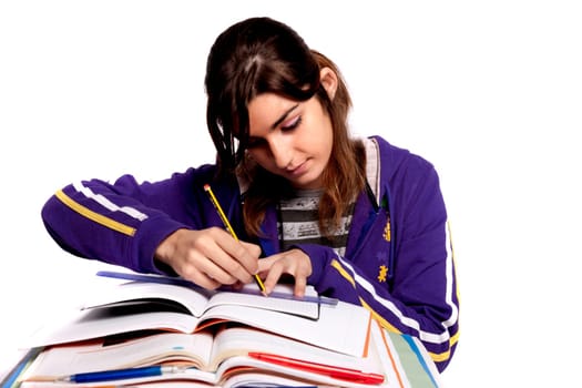 View of a teenager school girl studying on a white background.