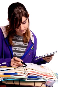 View of a teenager school girl studying on a white background.