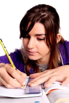 View of a teenager school girl studying on a white background.