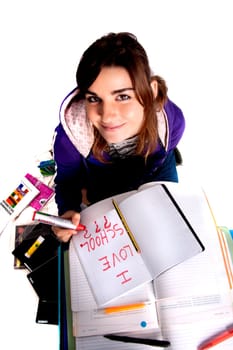 View of a teenager school girl looking at the camera with a smile.