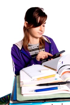 View of a teenager school girl studying on a white background.