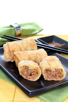 a spring roll filled with minced meat and tomatoes