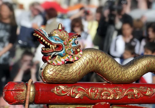 Detail statue Chinese dragon with people background