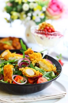 Big gourmet salad with mixed vegetable and curry chicken stripes