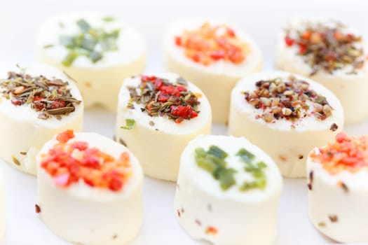 Delicious appetizer - cream cheese with different minced herbs and vegetables