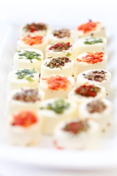 Delicious appetizer - cream cheese with different minced herbs and vegetables