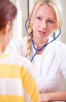 woman doctor examine a patient with stethoscope