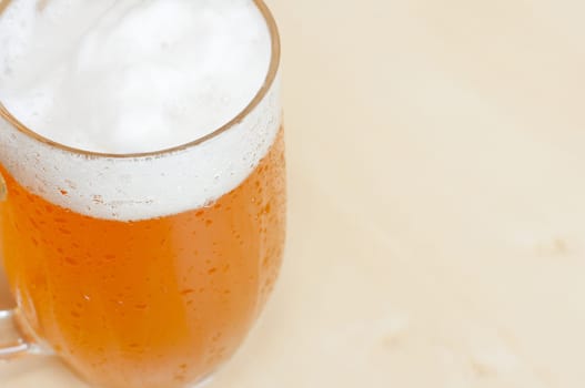 Detail of Draught Beer on the Wooden Table in Restaurant