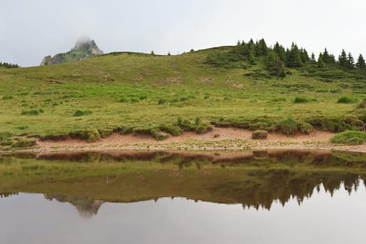 the reflection on lake a mountain top