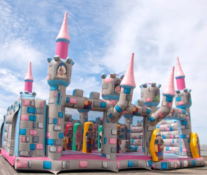 A Childrens Bouncy Castle under a blue sky