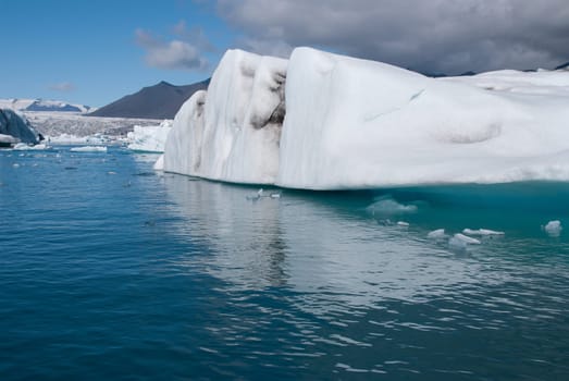 mountains and icebergs on the lake in Iceland Jokulsarlon