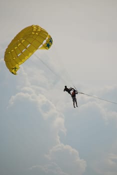 Open-air acrobats in parachute