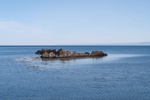 rock in the sea on the peninsula in iceland vatnsness