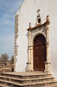 Church door inside the castle of Castro Marim, Algarve, Portugal