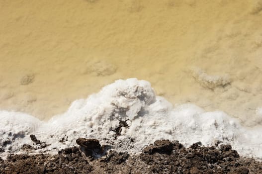 Crystallized salt in an evaporation pond, Algarve, Portugal