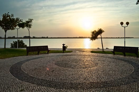 Sunrise over Guadiana river an the cobblestones of Vila Real de Santo António, Algarve, Portugal