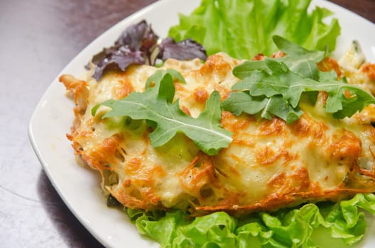 chicken fillet baked with zucchini, rucola lettuce