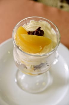 fresh baked cupcake with orange slices on a plate