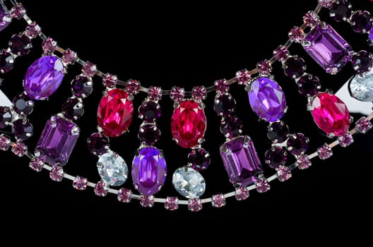pendant closeup with big gem at black background