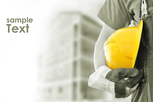 worker and the blurred construction in background with space for your text