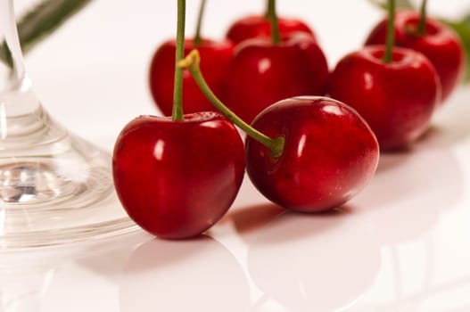 Fresh cherries against white background
