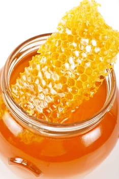 jar of organic honey on white background