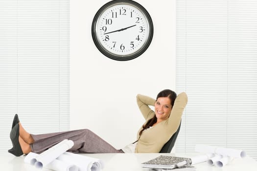 Office relaxation pose professional architect woman sitting behind table