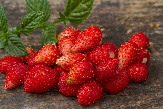 fresh Wild strawberries on wooden background