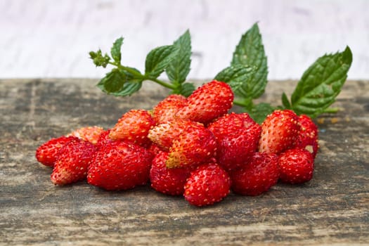 fresh Wild strawberries on wooden background
