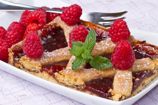 a raspberries tart with fresh fruits