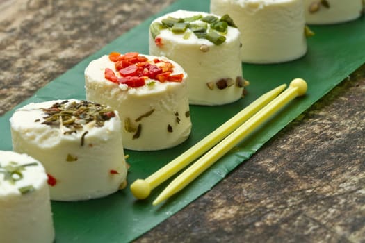 cheese with spices  on wooden background