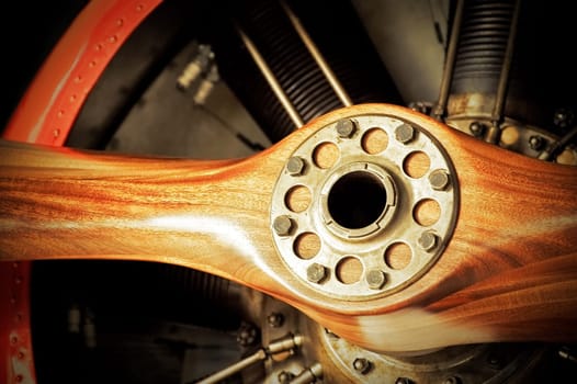 vintage wooden aircraft propeller and engine cylinders
