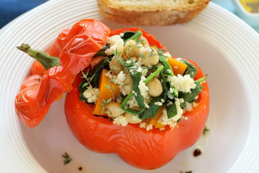 Roasted capsicum stuffed with cous cous, chick peas, spinach and pumpkin.