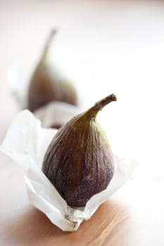 Delicious fresh figs on a wooden table. Studio shot.
