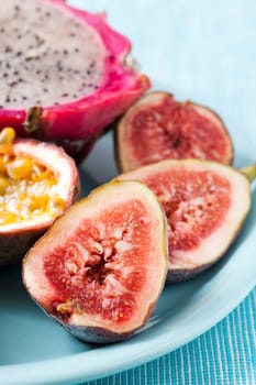Tropical fruit plate of Figs, Pitahaya and passion fruit.