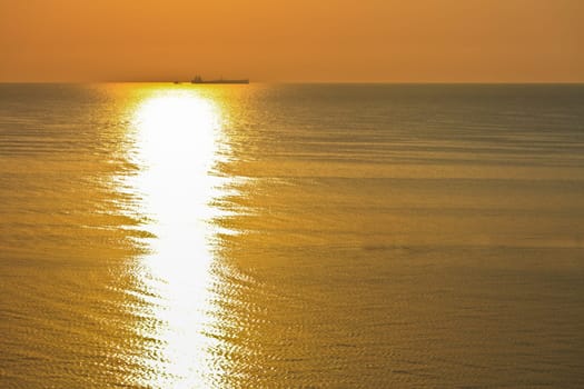 reflection of the sun at sunrise at sea