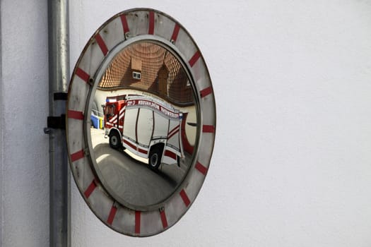 Fire truck in a traffic mirror