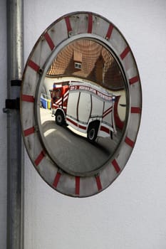 Fire truck in a traffic mirror