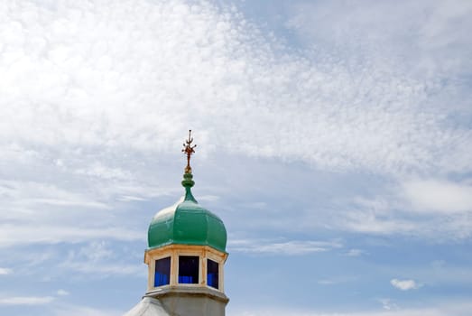 The Green Dome of a Pavilion with a weathervane on North Pier Blackpool under a blue sky