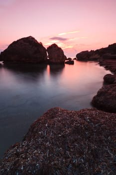 stones in water in a small bay